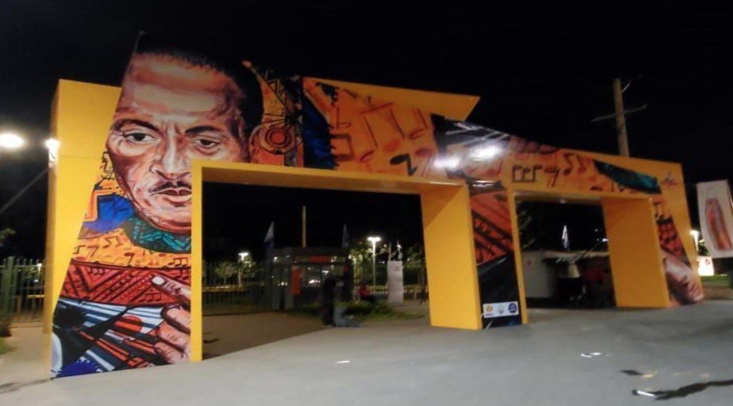 Artist mural gate at night