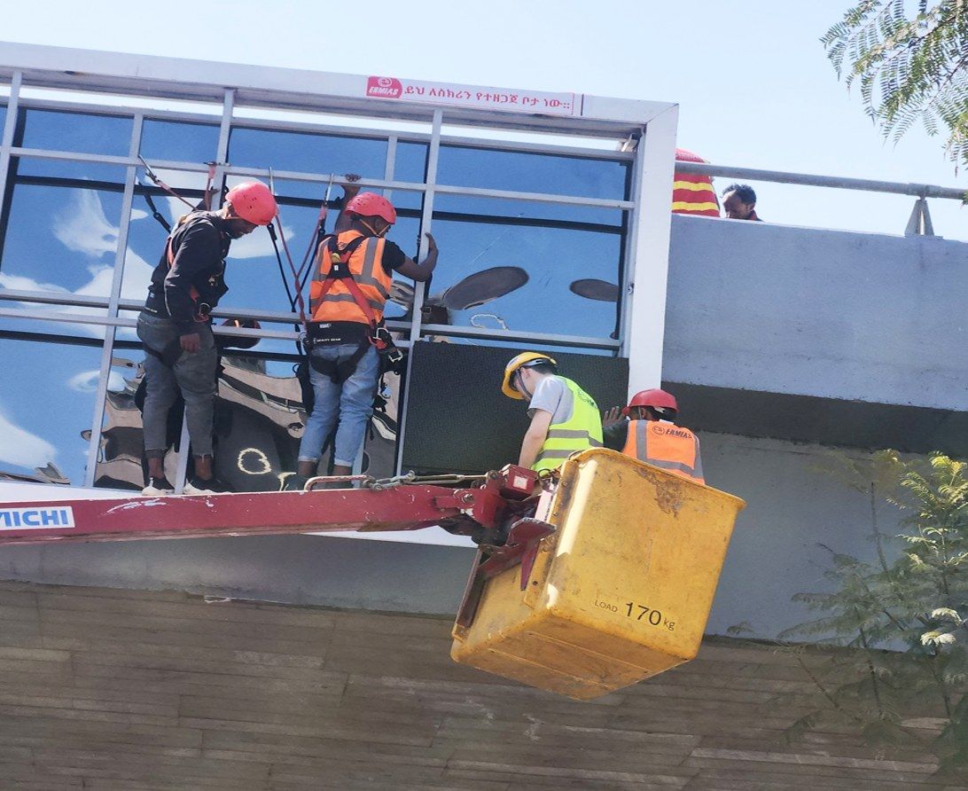 Installation crew on lift
